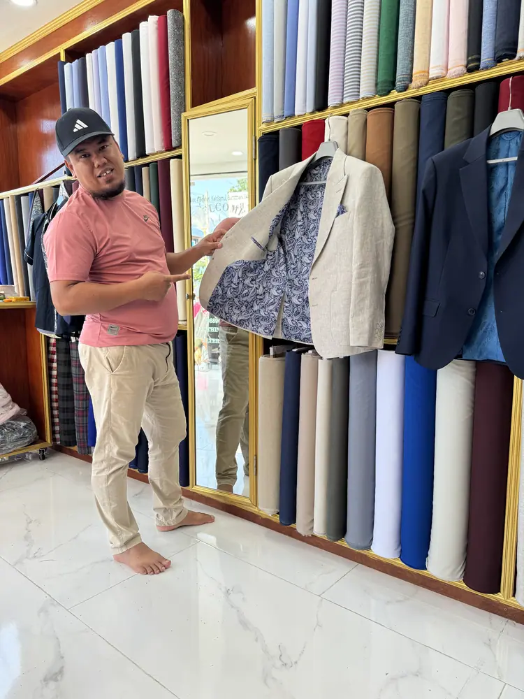 Client in a bespoke garment at Marco Bespoke Tailor, Bangrak