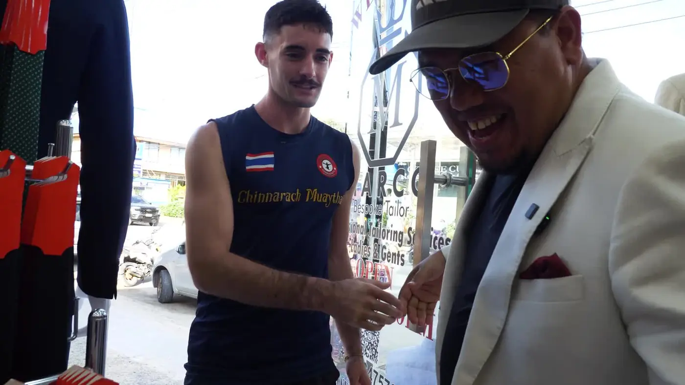 Marco welcoming a client into his Koh Samui shop